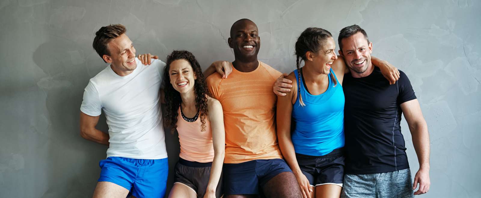 group of friends in gym gear