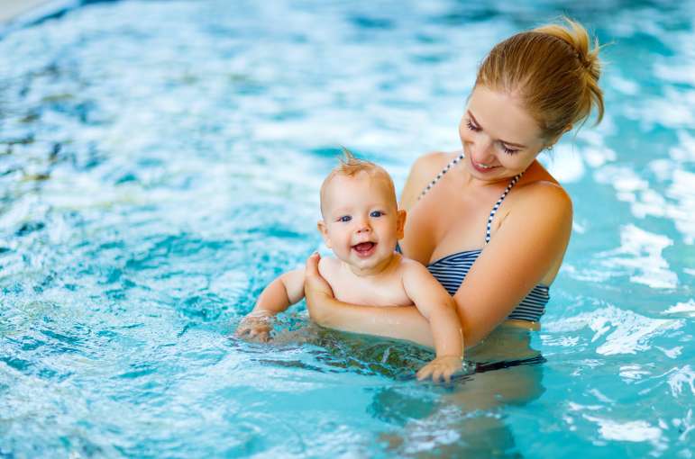 mother and baby in pool