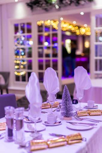 Tables set for Christmas party 