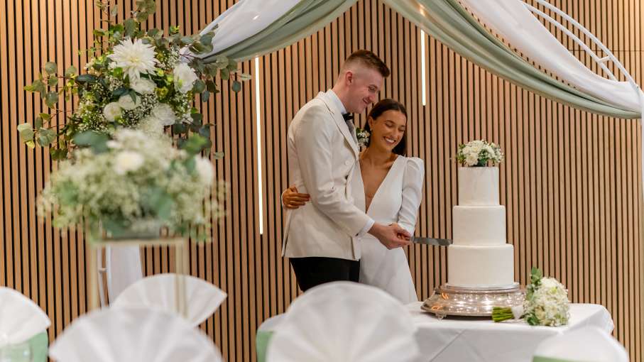 Newlyweds cutting cake at the Barnstaple Hotel