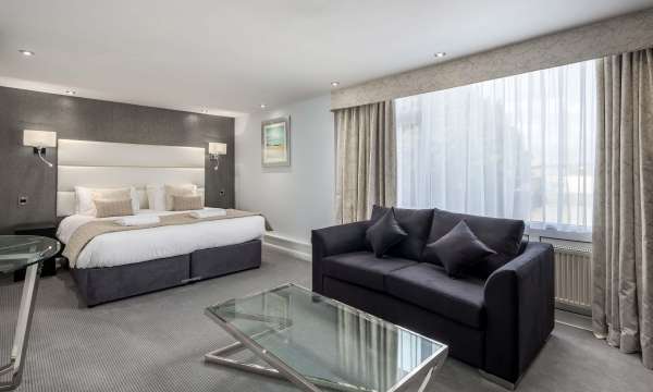 Barnstaple Hotel Deluxe Room Accommodation Bed and Seating Area