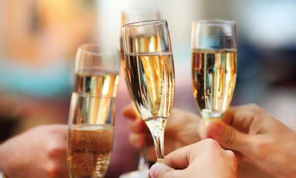 Wedding guests making a toast with champagne