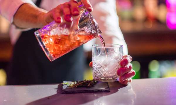 Bartender making smoking cocktails at Bar62 in Barnstaple