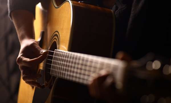 man playing a guitar