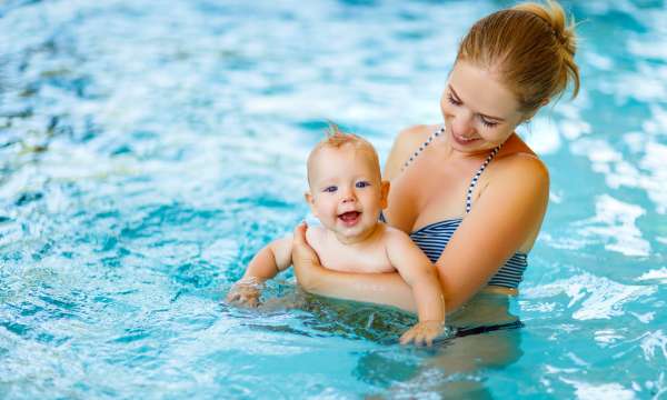 mother and baby in pool