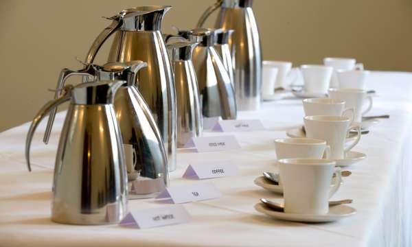 tea and coffee pots with cups