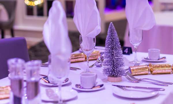 Tables set for Christmas party 