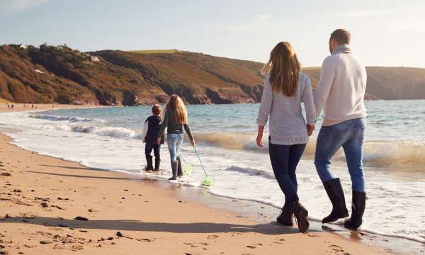 Family walking on the beach 