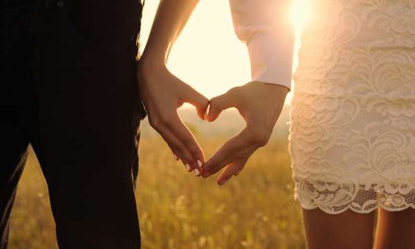 Bride and Groom posing during sunset 