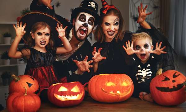 Family posing with pumpkins 