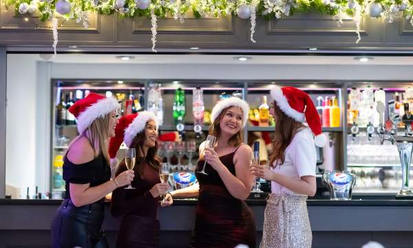 Woman drinking at bar