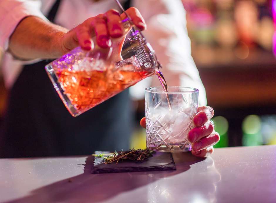 Bartender making smoking cocktails at Bar62 in Barnstaple