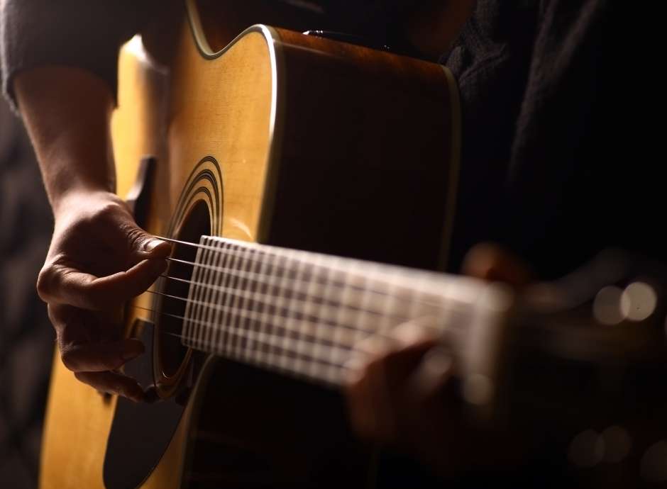 man playing a guitar