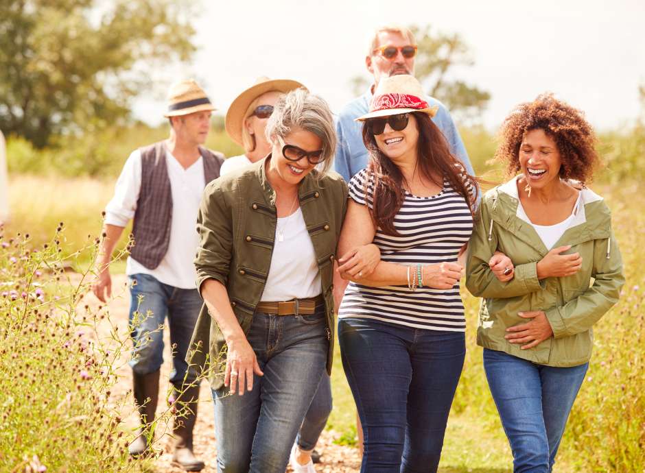 group of middle-aged people in field