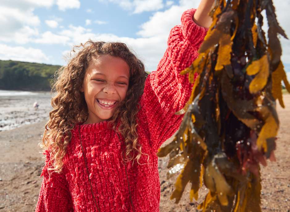 girl holding seaweed