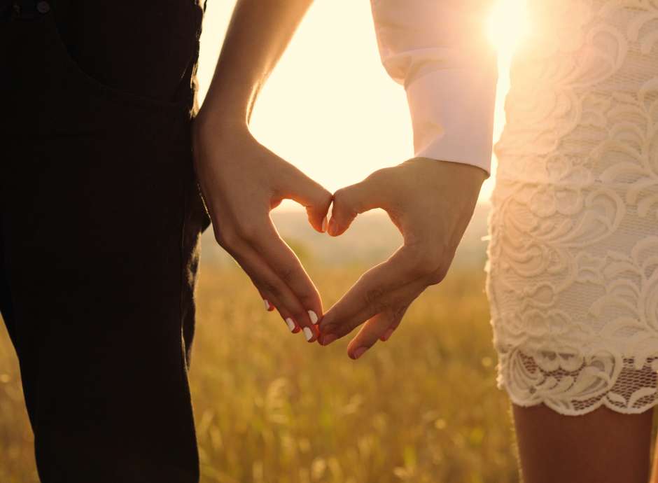 Bride and Groom posing during sunset 