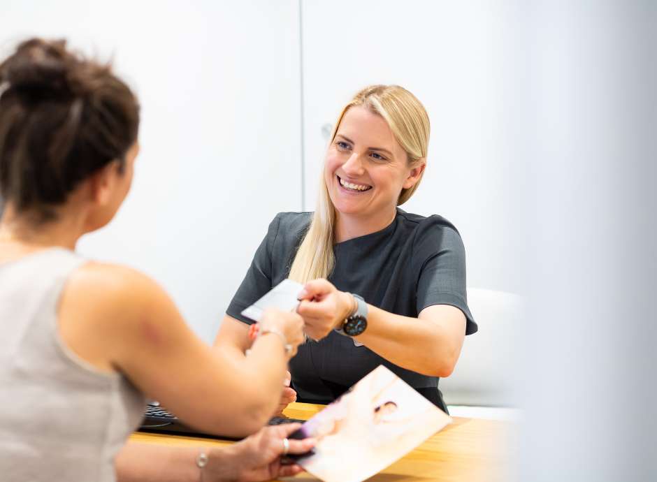 Woman signing up as a member