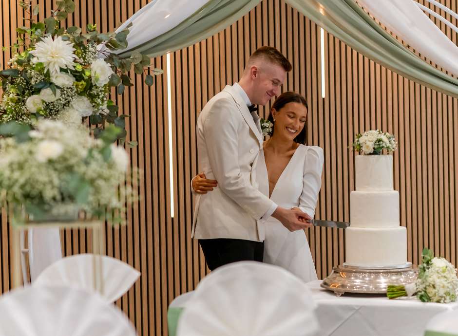 Newlyweds cutting cake at the Barnstaple Hotel