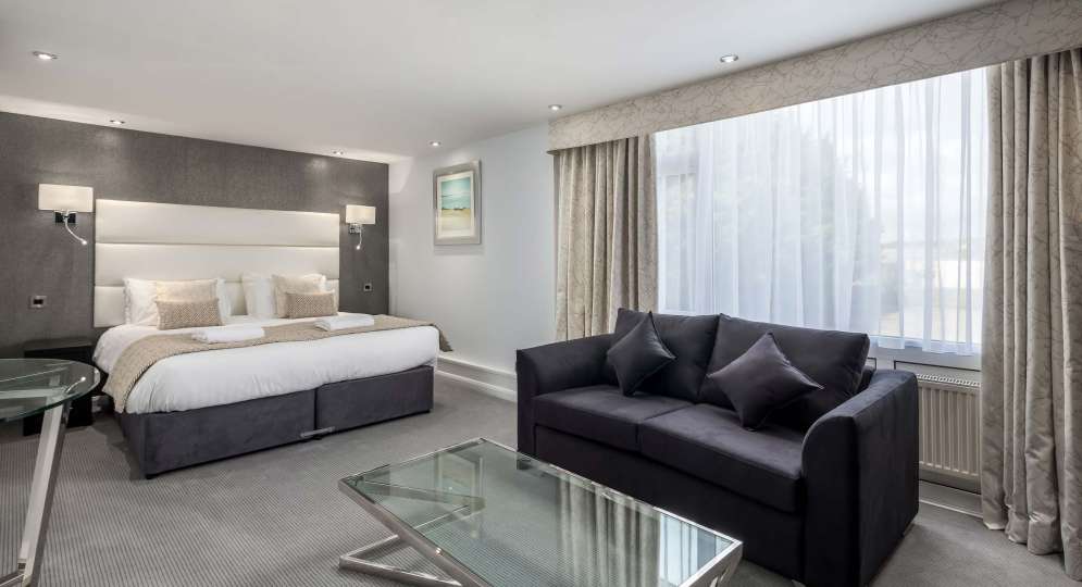 Barnstaple Hotel Deluxe Room Accommodation Bed and Seating Area