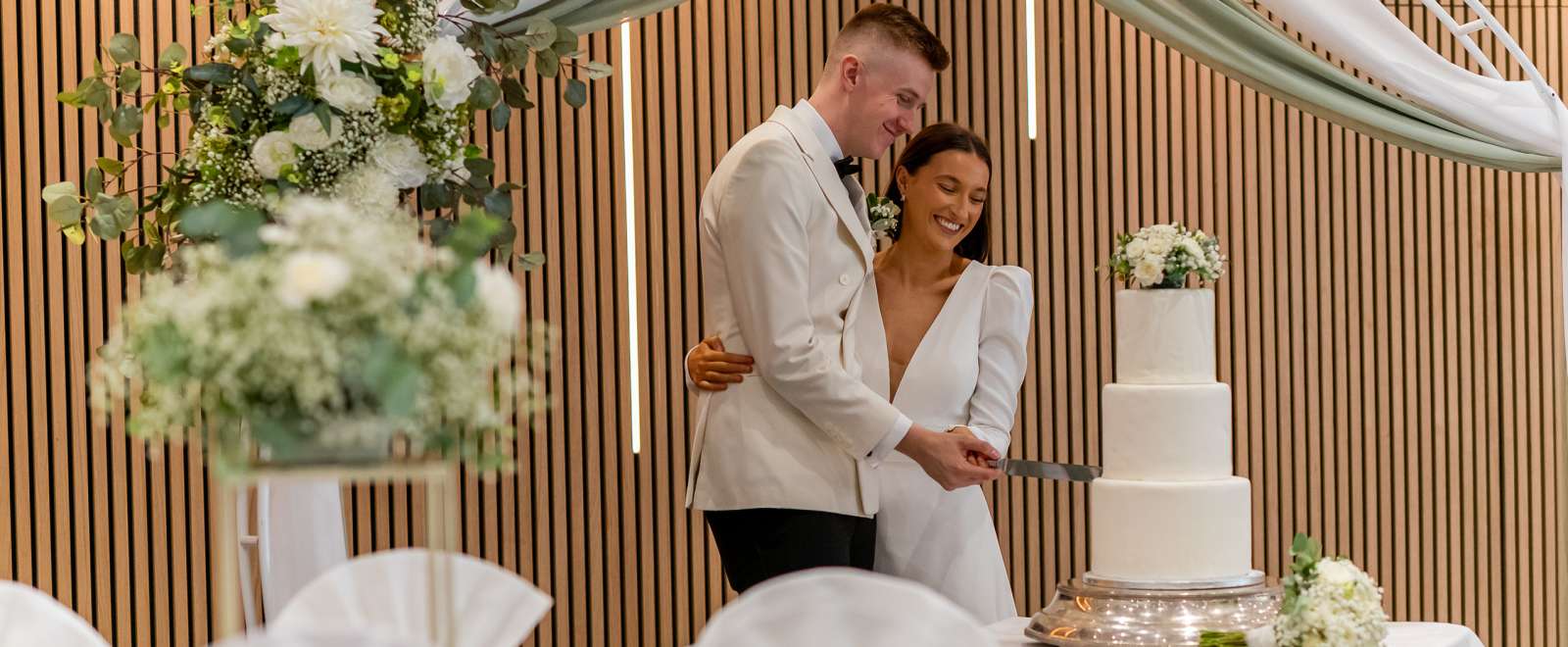 Newlyweds cutting cake at the Barnstaple Hotel