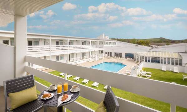 Barnstaple Hotel Pool View Room Balcony with Pastries and Coffee