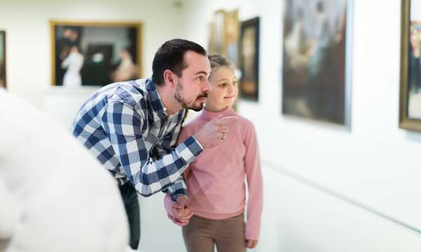 father and daughter in a museum