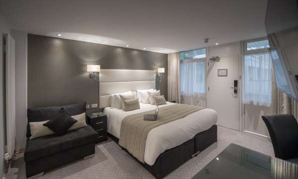 Bed with laptop on top