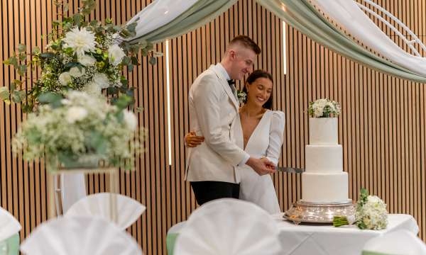 Newlyweds cutting cake at the Barnstaple Hotel